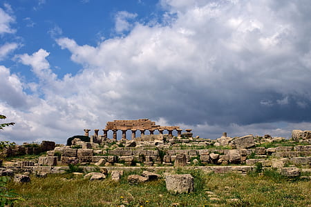 ruin temple under white and blue skies thumbnail