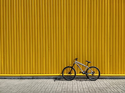 bicycle leaning on yellow intermodal container thumbnail