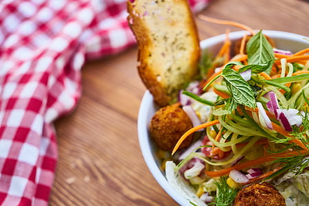 selective focus photography of vegetable salad on white bowl thumbnail