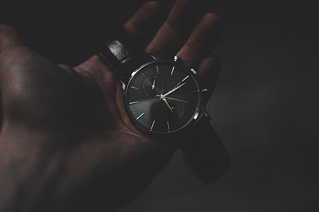 person holding chronograph watch at 6:16 thumbnail
