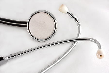 gray and black stethoscope on white surface thumbnail