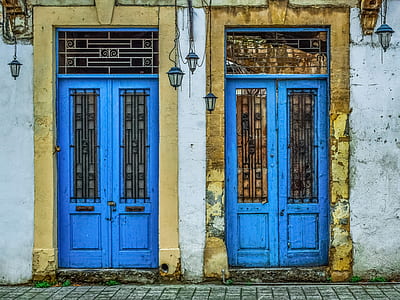 two blue wooden closed doors thumbnail