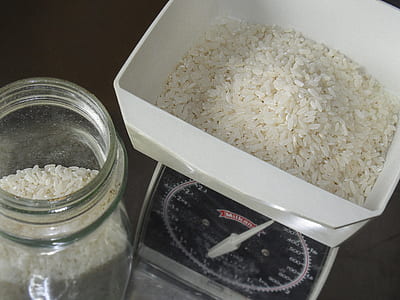 white and black analog scale on beside glass jar thumbnail