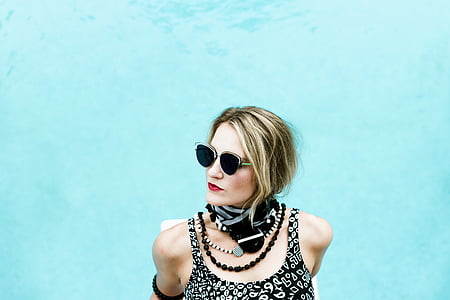 woman posing near body of water thumbnail
