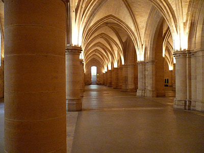 arch-shaped of brown concrete hallway with sconce light on thumbnail