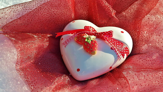 heart-shaped white decor on red textile thumbnail