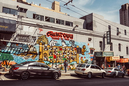 three cars parked beside the road during daytime thumbnail