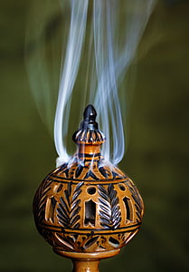 timelapse photography of round brown ornament excreting white smoke thumbnail
