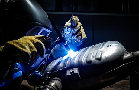person plasma welding gray vehicle gas tank thumbnail