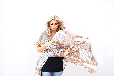 woman wearing brown and white floral top thumbnail