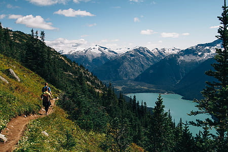 man and woman hiking on mountain thumbnail