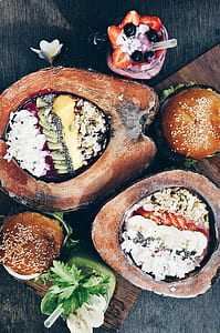 food on coconut and burger on brown wooden surface thumbnail