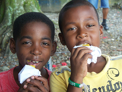 two boys eating while taking selfie thumbnail