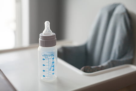 white labeled feeding bottle on white surface thumbnail