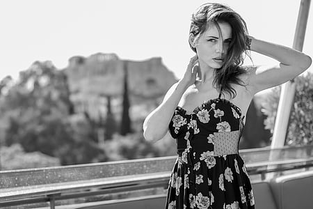 grayscale photo of woman wearing floral dress thumbnail