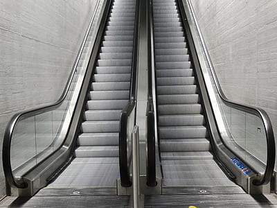 two gray escalators thumbnail