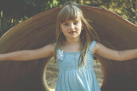Girl Wearing Blue Sleeveless Dress thumbnail