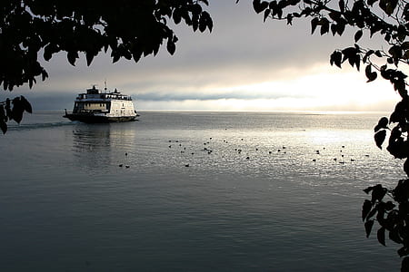 gray boat under gray sky thumbnail