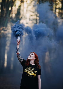 woman standing holding torch thumbnail