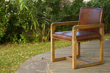 brown leather armchair with brown wooden frame thumbnail