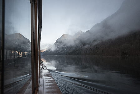 time lapse photography of boat near mountain thumbnail