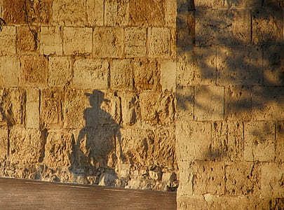 persons silhouette at brown concrete wall thumbnail