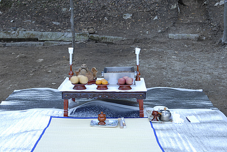 rectangular brown wooden table with candle on gray surface thumbnail