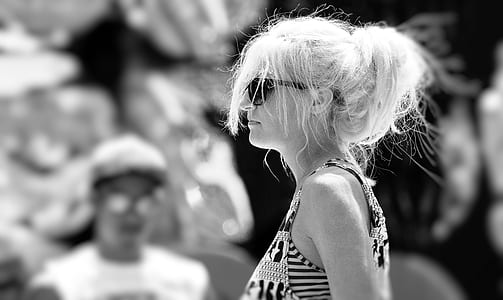 grayscale photo of woman wearing black sunglasses thumbnail