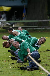 group of mens playing tug of war thumbnail
