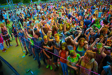 people with face paint standing on field thumbnail