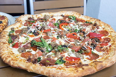 pepperoni pizza on brown surface thumbnail
