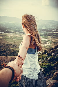 woman standing on cliff thumbnail