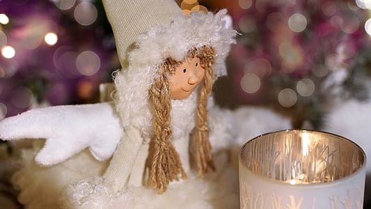 shallow focus photography of doll thumbnail