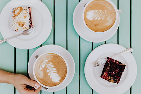 Drinking coffee and eating cake in a cafeteria thumbnail