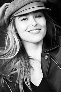 Grayscale Photography of Woman Wearing Hat thumbnail