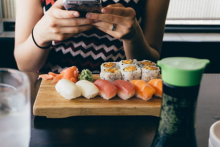 cooked sushi on brown wooden board thumbnail