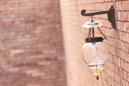 selective focus photography of black sconce thumbnail