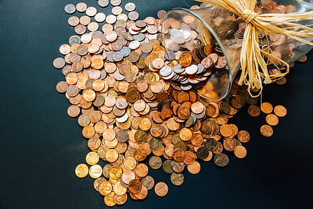 coins in glass vase thumbnail