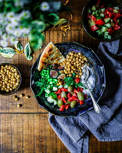 sliced bread, green and brown seeds on blue ceramic bowl thumbnail