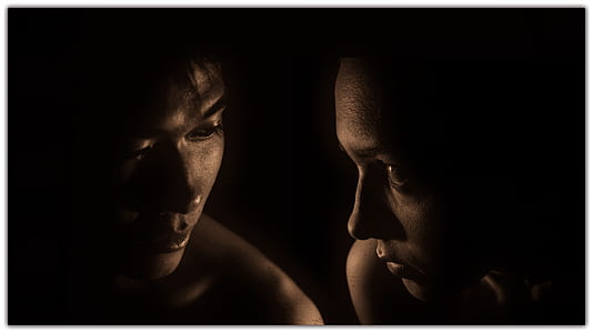 man and woman facing through the dark thumbnail