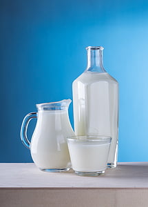 clear glass pitcher filled with milk thumbnail