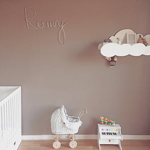 baby's white wicker bassinet and piano toys thumbnail