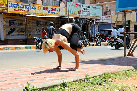 woman wearing black tube top doing exhibition on road thumbnail
