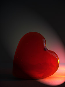 red polished heart stone on white surface thumbnail