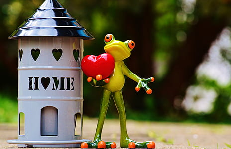 frog holding heart figurine thumbnail