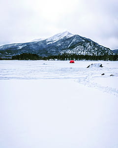 red tent on snow field thumbnail