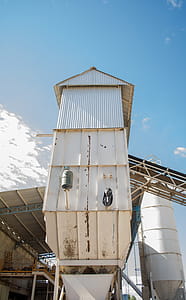 White G.i Sheet Tower Under Blue Sky thumbnail