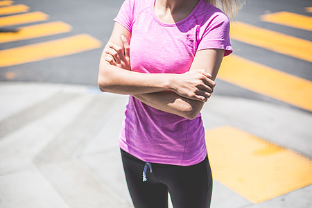 Fitness Girl Waiting At a Street Corner Near The Pedestrian Crossing thumbnail