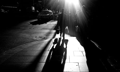 silhouette of persons walking at walkway thumbnail