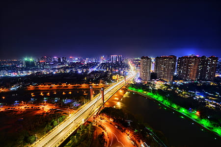 time lapse photography of moving vehicles on bridge thumbnail